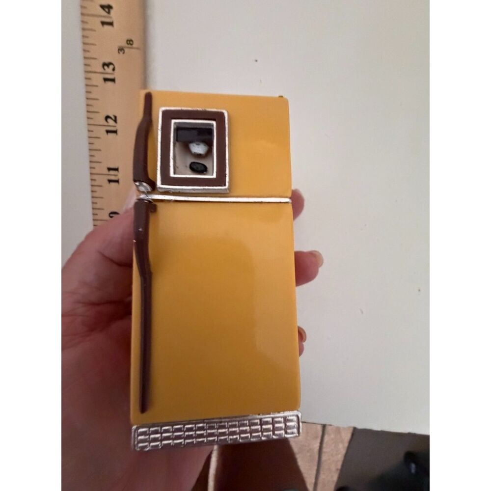 vtg. 1970s kitschy yellow miniature refrigerator salt shaker